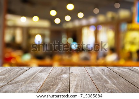 Space for placing items on the table, closeup top wood table with Blur Background, for your photo montage or product display.