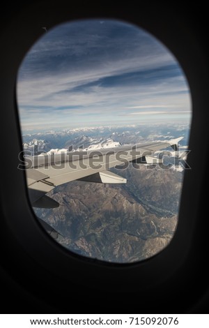 Panorama seen from a porthole of an airplane.