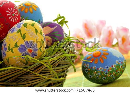 Hand painted beautiful  colorful  easter eggs in wicker basket