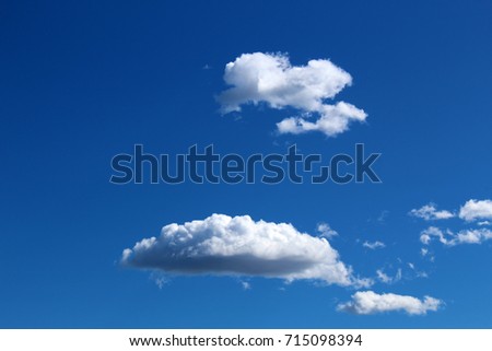 Gray scattered clouds and blue sky