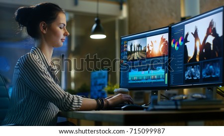 Female Video Editor Works with Footage and Sound on Her Personal Computer. She Works Late. Her Office is Modern and Creative Loft Studio.