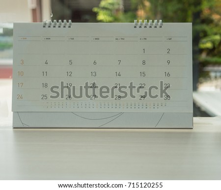 Calendar on  table in shop.