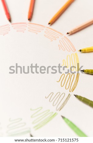 Circle with different colorful strokes painted with markers on white paper. Gradient of colorful strokes. Copy space for logo, advertisement