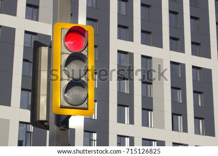traffic light on a background of a blurred building