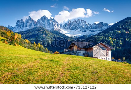 Great view of Santa Maddalena village in front of the Geisler or Odle Dolomites Group. Colorful autumn scene of Dolomite Alps, Italy, Europe. Traveling concept background.
