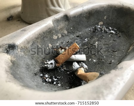 Filtered cigarettes in ashtray