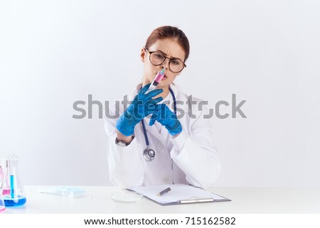 work in the hospital, doctor with glasses on a light background, healthcare                               