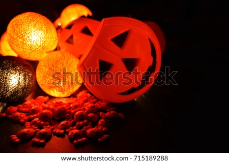 The concept of light on the night Halloween. Devil pumpkins give candy to children.With copy space for text.