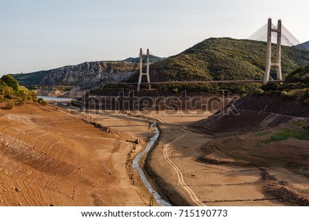 Barrios de Luna Reservoir during drought and cable-stayed bridge of the highway, Leon, Spain.