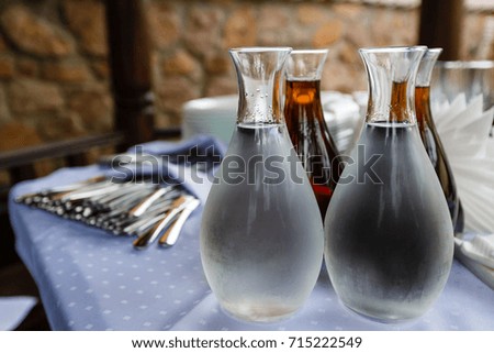 decanters with vodka and wine on the table