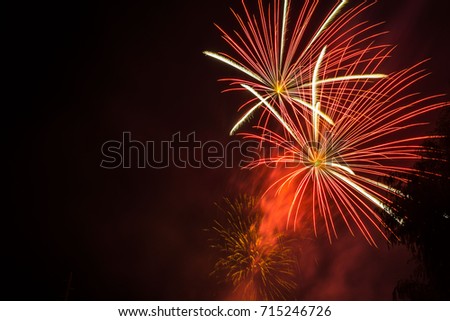 Celebration beautiful colorful fireworks over night sky copy space. Holidays salute. Independence Day. New Year. Red amazing fireworks, Royalty-Free Stock Photo #715246726