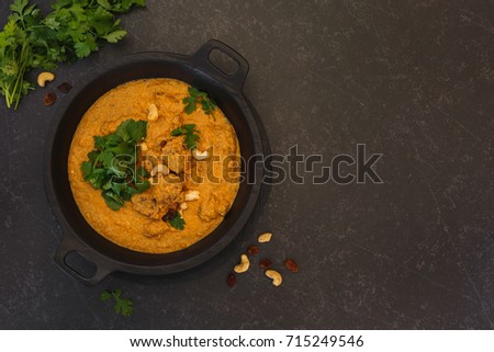  Spicy mutton  korma with cashew nuts and coriander leaves. Top view with blank space on right side Royalty-Free Stock Photo #715249546