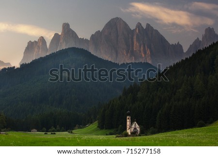 Church on a background of mountains. Dolomites, Italy
