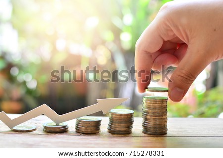 coins saving increase to profit for concept investment fund finance and business  Royalty-Free Stock Photo #715278331