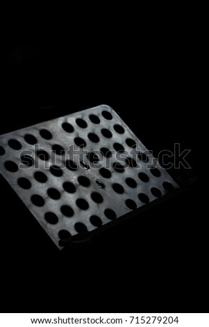 Close-up metal black music stand in the dark room or black background