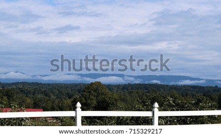 blue ridge mountains with low white clouds