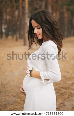 Pregnant girl in white dress