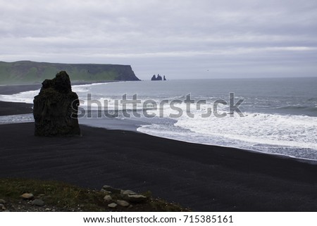The black sand beach and cliffs of Reynisfjara in the southern coast of Iceland. Backgrounds.