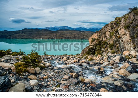 Hike in Torres del Paine, turquoise coloured-lake near Glacier Grey. Chile, Patagonia.
