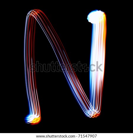 N - Created by light colorful letters over black background
