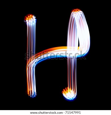H - Created by light colorful letters over black background