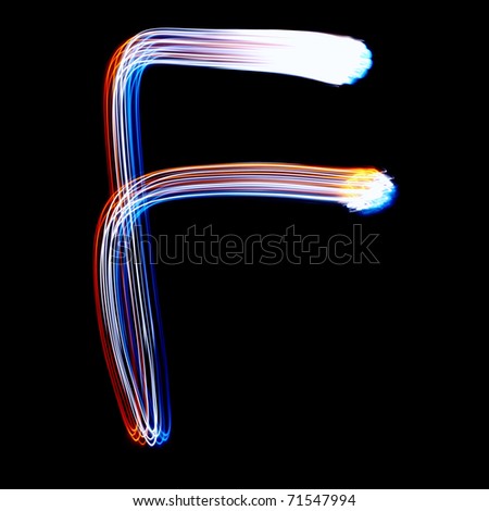 F - Created by light colorful letters over black background