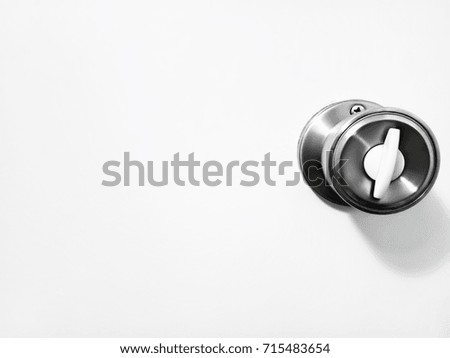 Door knob in public restroom in Japan. This image was blurred or selective focus.  Black and white picture.