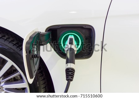 Close up Power supply connect to electric car for add charge to the battery. Charging re technology industry transport which are the future of the Automobile.