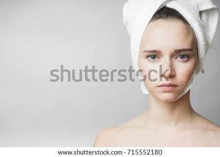 Beautiful woman with towel on the head looking to camera,smile. Skin care