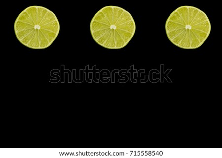 Lime slices isolated on black background.