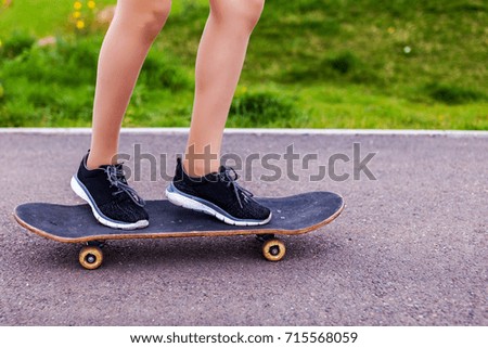 Without a face. Teen girl with skateboard with Outdoors, urban lifestyle. Without face. manual skateboard hold