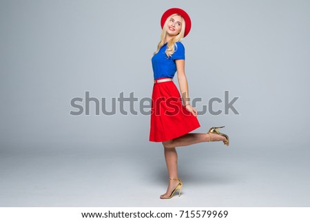 people, style and fashion concept - happy young woman or teen girl in casual clothes and hipster hat having fun