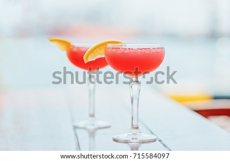 Two cosmopolitan cocktails on the table