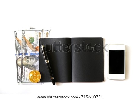 Flat Lay photo with Notebook ,Cell phone , Us dollar , pen and  bitcoin on Pink Petal Color background