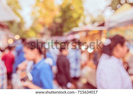 Abstract blur image of Day market on street with bokeh for background usage . (vintage tone)