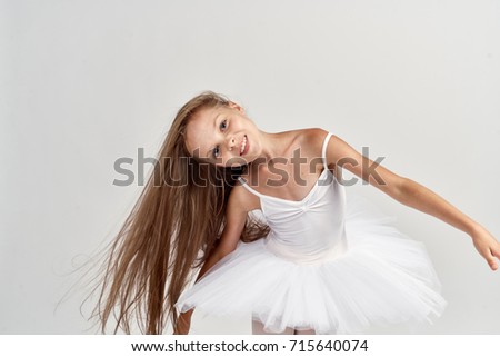 dance, choreography, classics, art, small ballerina smiling on a light background portrait                               
