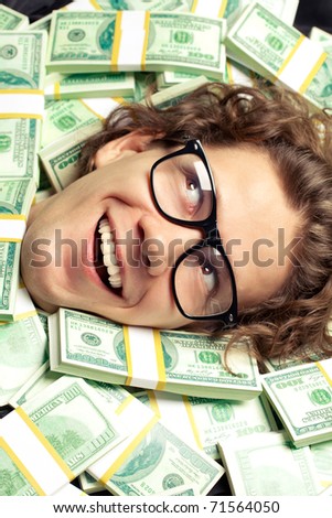 Funny curly man lying on money