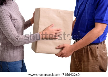 Woman customer receiving the parcel from delivery man. Business and logistic concept.