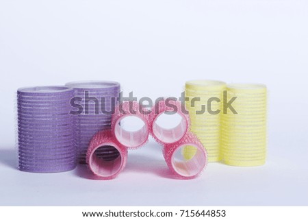 Colorful curlers isolated on white background