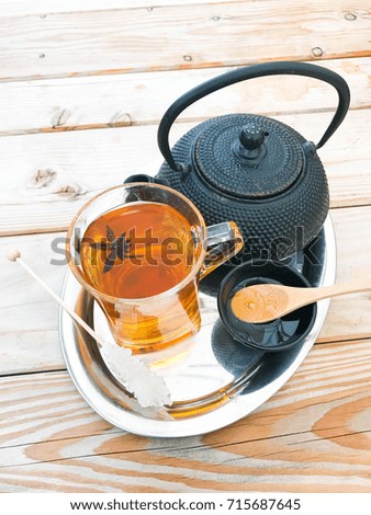 Tea with cardamon and herbs. Cozy autumn photo