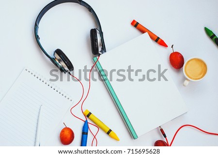 audio book concept. headphones and book on a white background