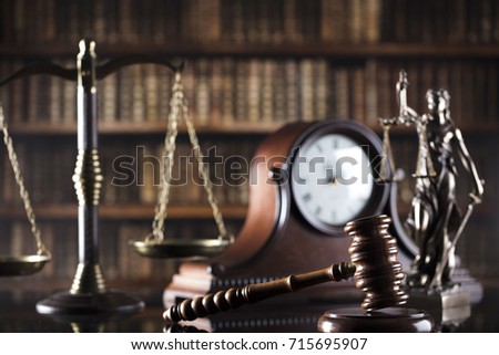 Old library. Vintage clock. Statue of justice and gavel. Law symbols.