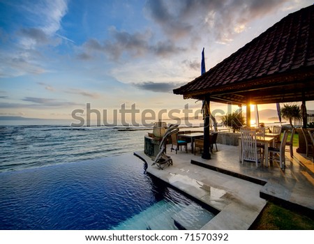 Sunset over Balinese coastline Royalty-Free Stock Photo #71570392