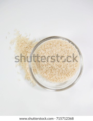 Bowl of uncooked basmati rice from above Royalty-Free Stock Photo #715712368