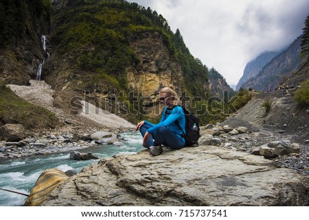 Beautiful young girl hiking at Annapurna Circuit Trek - Travel Nepal