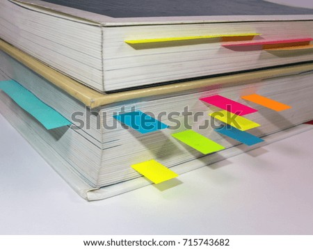 Books with colorful post-it notes