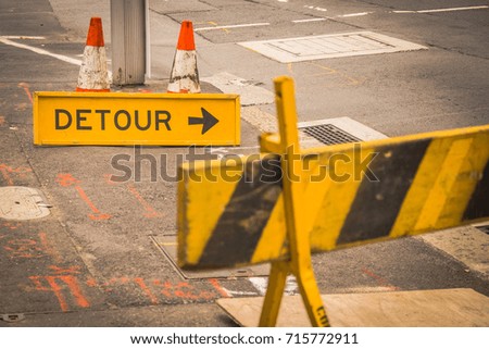 Yellow sign show Detour way crossing construction road