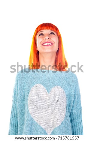 Attractive redhead girl looking up isolated on a white background