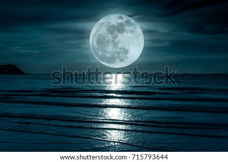 Super moon. Colorful sky with cloud and bright full moon over seascape in the evening. Serenity nature background, outdoor at nighttime. The moon taken with my own camera.