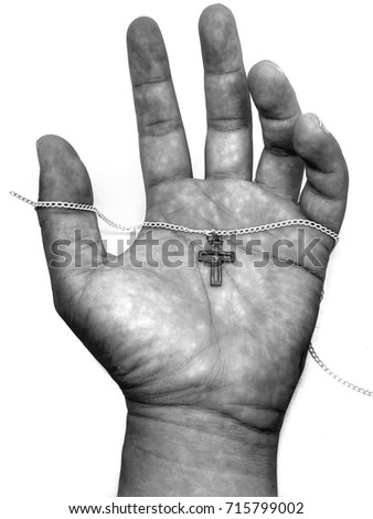 Strength Christ cross necklace on dirty hand, monochrome process with white background